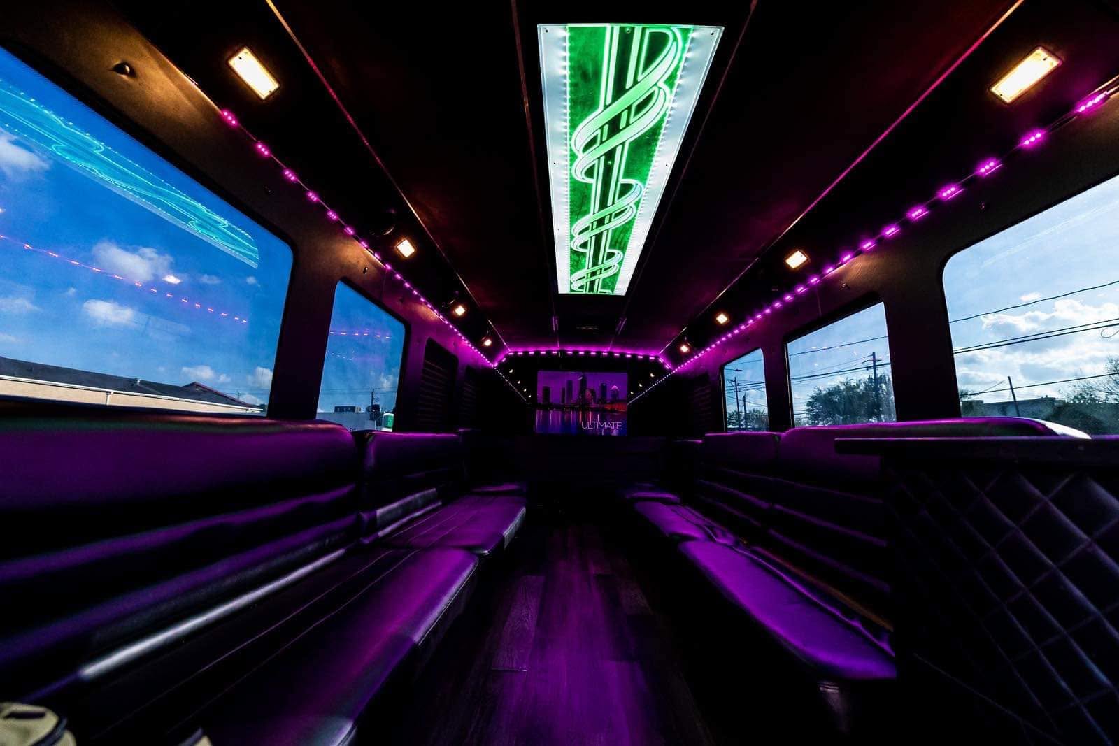 Party bus interior glowing purple and green